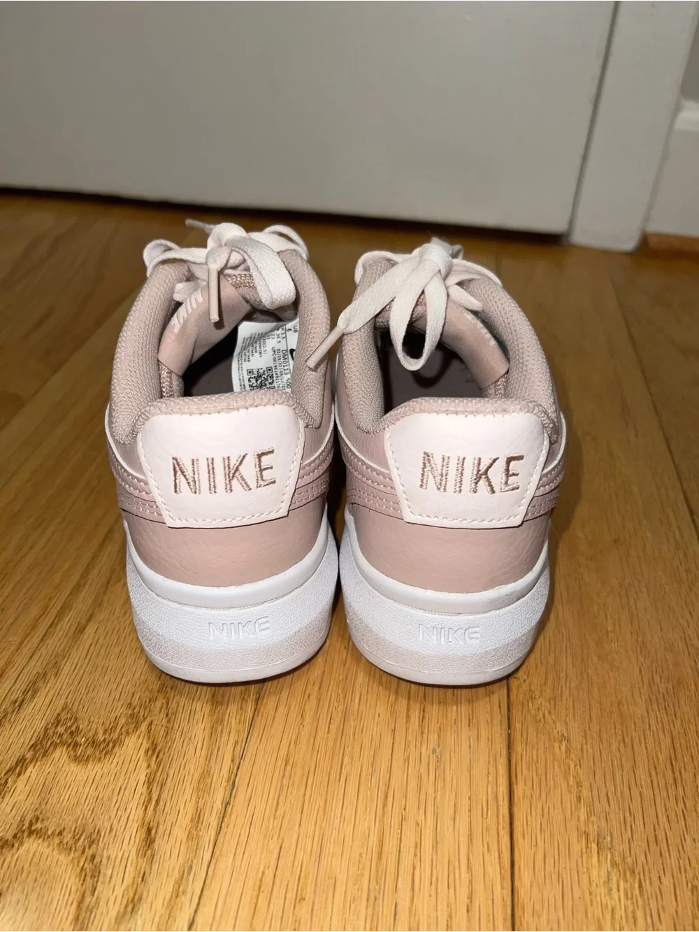 Nike Women’s Low-Top Lace-Up Sneakers in Light Pink and White